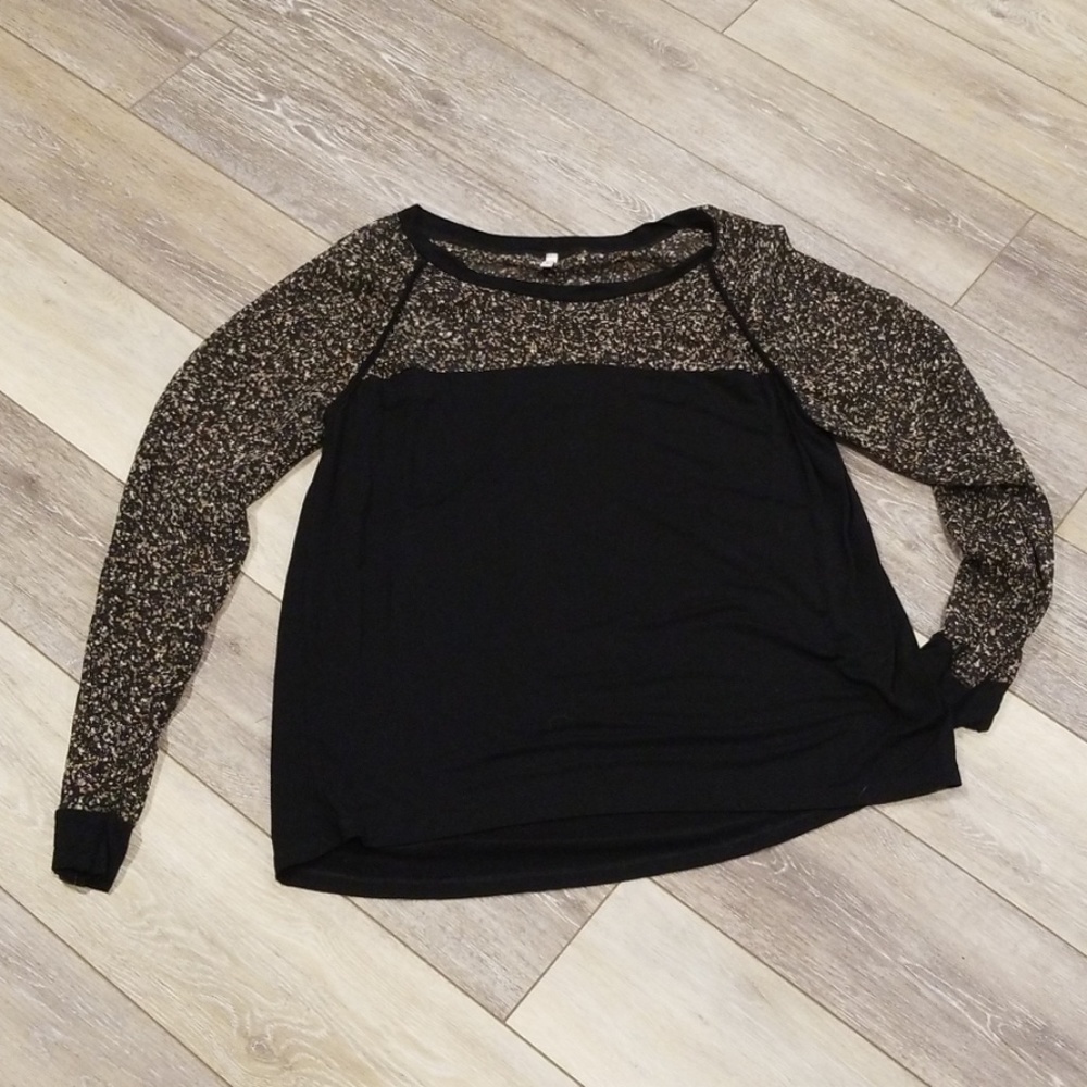 Long sleeved black with see thru speckled sleeves